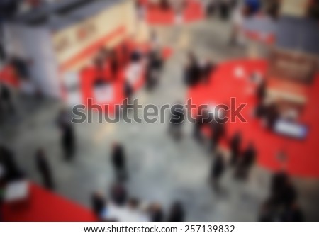 Trade show people background. Intentionally blurred editing post production.