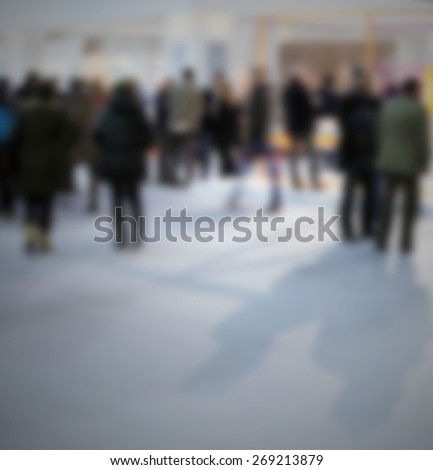 People at trade show. Intentionally blurred editing post production.
