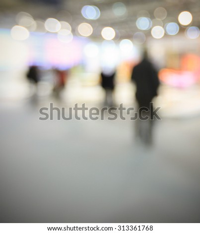 People at fair, intentionally blurred post production background.