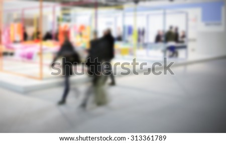 Group of women during an event, intentionally blurred post production background.