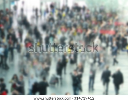 People crowd generic background, intentionally blurred post production.