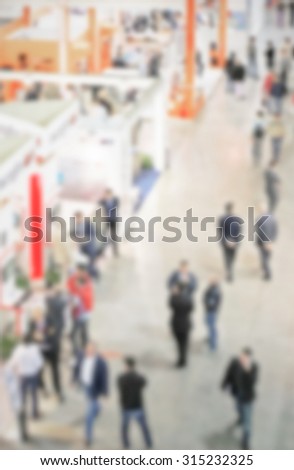 Trade show, generic background, intentionally blurred post production.