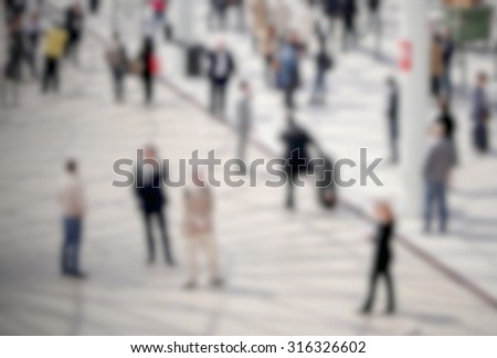 People crowd, generic background, intentionally blurred post production.