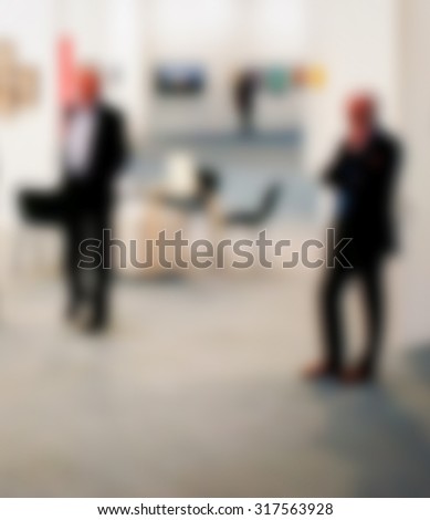 Men walking, generic background, intentionally blurred post production.