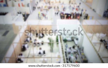 Trade show generic background, panoramic view, intentionally blurred post production.