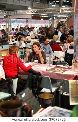 MILAN, ITALY - OCT. 16: People participating to art of painting lessons at Hobby Show, Italian showroom of the fine arts and manual creativity October 16, 2009 in Milan, Italy.