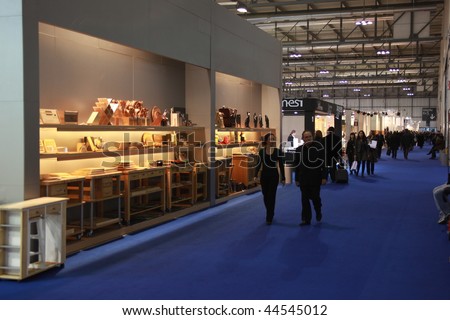 MILAN, ITALY - JANUARY 15: People walking trough stands dedicated to home furnishings at Macef, International Home Show Exhibition January 15, 2010 in Milan, Italy.