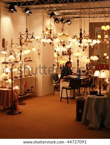 MILAN, ITALY - JANUARY 15: Woman working into a luxury lights stand at Macef, International Home Show Exhibition January 15, 2010 in Milan, Italy.
