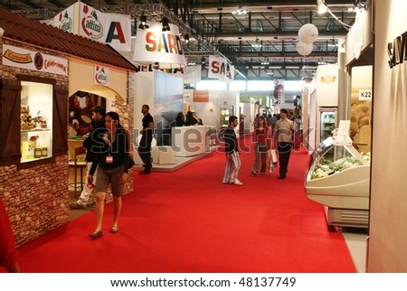 MILAN, ITALY - JUNE 10: People wak trough local productions made in Italy at Tuttofood 2009, World Food Exhibition June 10, 2009 in Milan, Italy.