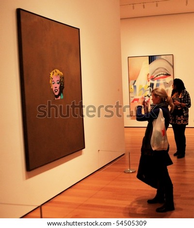 NEW YORK, US - DEC. 09: Girl taking picture of famous painting representing Marylin Monroe at Moma Museum December 09, 2009 in New York, US.