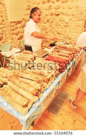 MANTOVA, ITALY - JUNE 14: Salami production in exhibition at Golosaria, national fair of food and gastronomy culture June 14, 2010 in Mantova, Italy.