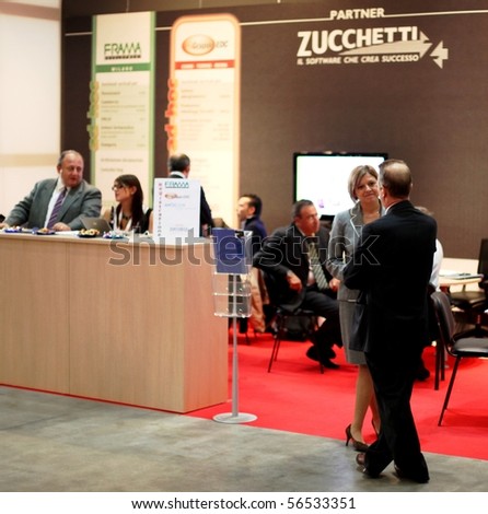MILAN, ITALY - OCT. 21: People visiting technologies exhibition stands at SMAU, national fair of business intelligence and information technology October 21, 2009 in Milan, Italy.
