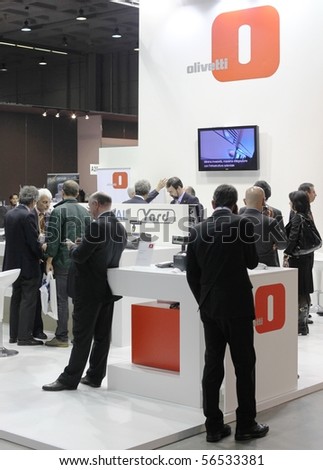 MILAN, ITALY - OCT. 21: People visiting technologies exhibition stands at SMAU, national fair of business intelligence and information technology October 21, 2009 in Milan, Italy.