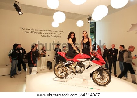 MILAN, ITALY - NOV. 03: People look at Agusta Motorcycles Art stand in exhibition at EICMA, 68th International Motorcycle Exhibition November 03, 2010 in Milan, Italy.