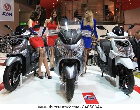 MILAN, ITALY - NOV. 03: Top models at SYM stand during EICMA, 68th International Motorcycle Exhibition November 03, 2010 in Milan, Italy.