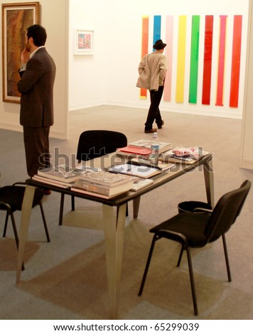 MILAN - MARCH 27: People visit paintings galleries at MiArt ArtNow, international exhibition of modern and contemporary art March 27, 2010 in Milan, Italy.
