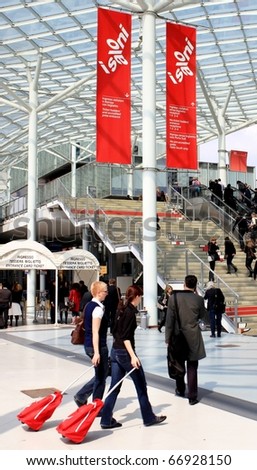 MILAN - APRIL 15: People enter Salone del Mobile, international furnishing accessories exhibition April 15, 2010 in Milan, Italy.