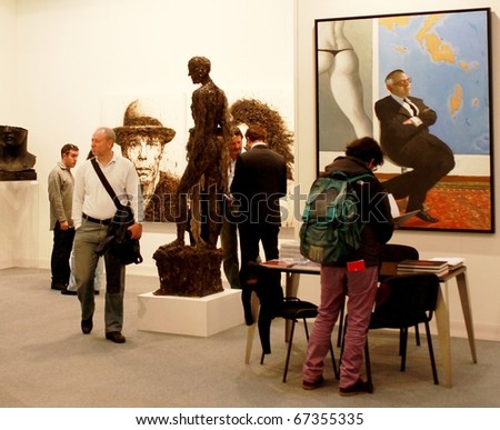 MILAN - MARCH 27: People look at painting galleries during MiArt ArtNow, international exhibition of modern and contemporary art March 27, 2010 in Milan, Italy.