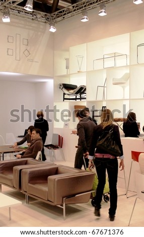 MILAN - APRIL 15: People looking at interior design solutions in exhibition at Salone del Mobile, international furnishing accessories exhibition April 15, 2010 in Milan, Italy.