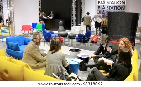 MILAN - APRIL 15: People visiting interior design stands at Salone del Mobile, international furnishing accessories exhibition April 15, 2010 in Milan, Italy.
