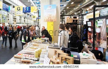 TORINO, ITALY - OCT. 24: People visit local and international food stands at Salone del Gusto, international fair of tastes and slow food on October 24, 2010 in Torino, Italy.