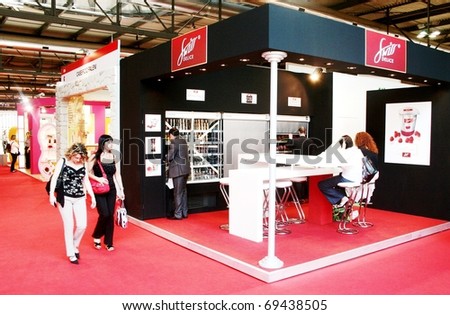 MILAN, ITALY - JUNE 10: People visiting local and regional food and drink production stands at Tuttofood 2009, World Food Exhibition June 10, 2009 in Milan, Italy.