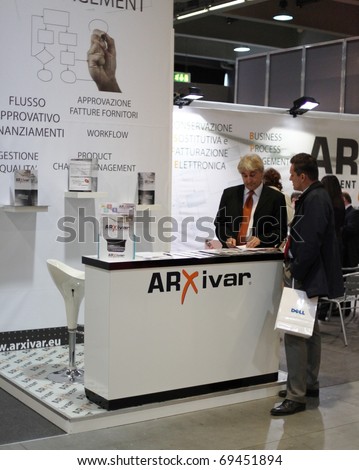 MILAN, ITALY - OCT. 21: People visiting office technology stands at SMAU, national fair of business intelligence and information technology October 21, 2009 in Milan, Italy.