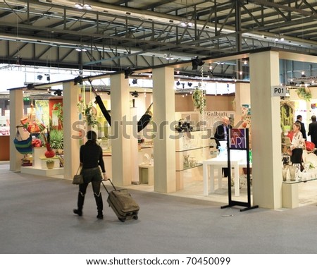 MILAN, ITALY - JANUARY 28: Looking for design and interior decoration products at Macef, International annual Home Show Exhibition attracting thousands of visitors January 28, 2011 in Milan, Italy.