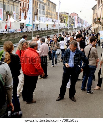 MILAN - APRIL 29: People joining showcase opening at NavigaMI Salone Nautico, boat show exhibition in the area of Navigli April 29, 2010 in Milan, Italy.