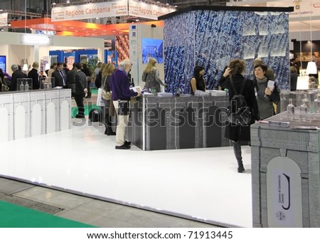MILAN, ITALY - FEBRUARY 17: People visit tourism stands at Italy showtrade pavilion during BIT, International Tourism Exchange Exhibition on February 17, 2011 in Milan, Italy.