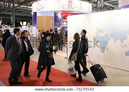 MILAN, ITALY - FEBRUARY 20: People walk trough national tourism pavilion during BIT, International Tourism Exchange Exhibition on February 20, 2010 in Milan, Italy.