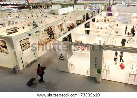 MILAN, ITALY - JANUARY 28: Panoramic view of people looking for design and interior decoration products at Macef, International Home Show Exhibition on January 28, 2011 in Milan, Italy.