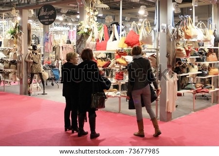 MILAN, ITALY - JANUARY 28: People visit stands looking for design and interior decoration products at Macef, International Home Show Exhibition January 28, 2011 in Milan, Italy.