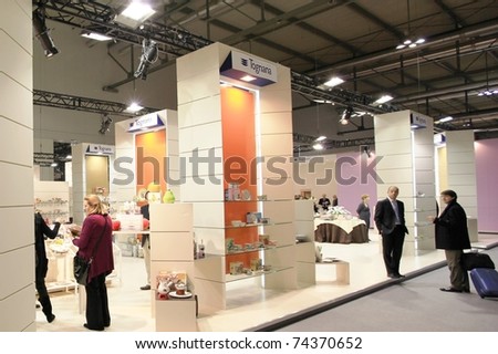 MILAN, ITALY - JANUARY 28: People walk through stands looking for design and interior decoration products stands at Macef, International Home Show Exhibition on January 28, 2011 in Milan, Italy.