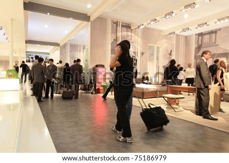 MILAN - APRIL 13: People look at interior design solutions and home architecture decorations at Salone del Mobile, international furnishing accessories exhibition on April 15, 2010 in Milan, Italy.