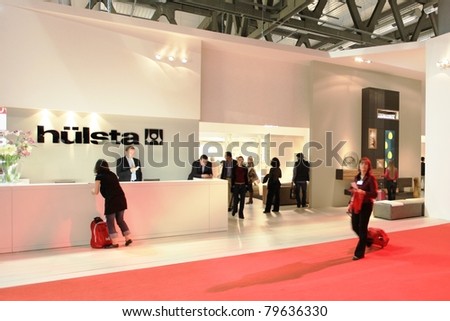 MILAN - APRIL 13: Visitors look at interior design solutions at Salone del Mobile, international furnishing accessories exhibition on April 13, 2011 in Milan, Italy.