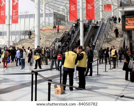 MILAN - APRIL 13: People at the entrance of Salone del Mobile, international furnishing accessories exhibition on April 13, 2011 in Milan, Italy.