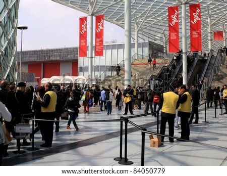 MILAN - APRIL 13: People at the entrance of Salone del Mobile, international furnishing accessories exhibition on April 13, 2011 in Milan, Italy.