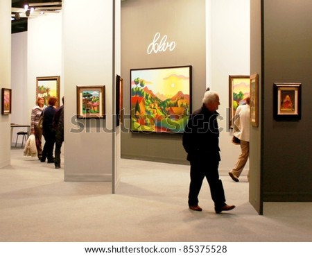 MILAN - MARCH 27: Visitors look at work of arts galleries during MiArt ArtNow, international exhibition of modern and contemporary art March 27, 2010 in Milan, Italy.