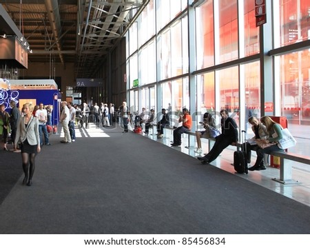 MILAN - APRIL 13: People at the entrance of exhibition, ready to visit design pavilions at Salone del Mobile, international furnishing accessories exhibition on April 13, 2011 in Milan, Italy.
