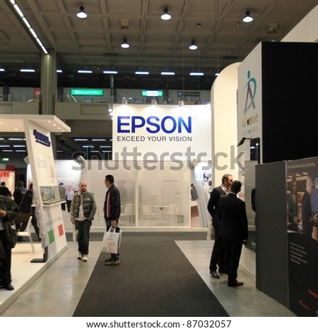 MILAN, ITALY - OCT. 19: People visit Epson technologies stand during SMAU, international fair of business intelligence and information technology October 19, 2011 in Milan, Italy.