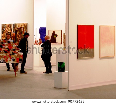 MILAN - MARCH 27:People look at work of arts in exhibition at MiArt ArtNow, international exhibition of modern and contemporary art March 27, 2010 in Milan, Italy.