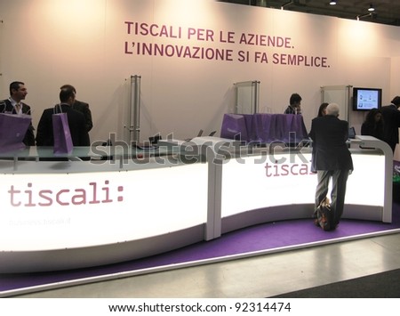 MILAN, ITALY - OCT. 19: People visit Tiscali technologies stand at SMAU, international fair of business intelligence and information technology October 19, 2011 in Milan, Italy.