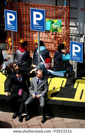 MILAN, ITALY - APRIL 20: People at persons parking area, Zona Tortona area during Fuorisalone, fashion and public design festival show April 20, 2009 in Milan, Italy.