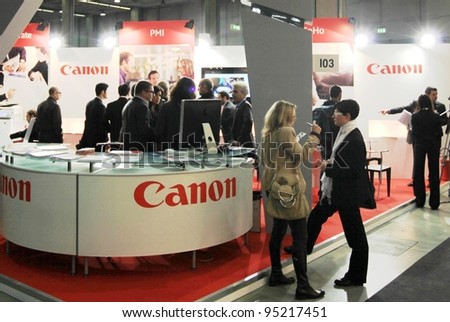MILAN, ITALY - OCT. 19: People visit Canon technologies stands at SMAU, international fair of business intelligence and information technology on October 19, 2011 in Milan, Italy.