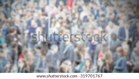 People crowd generic background, intentionally blurred post production.