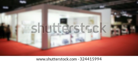 Trade show people, generic background. Intentionally blurred post production.