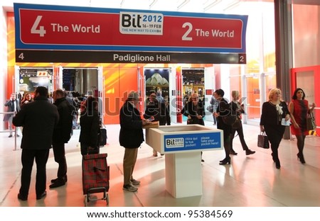 MILAN, ITALY - FEBRUARY 16: People enter World tourism exhibition area during BIT, International Tourism Exchange Exhibition February 16, 2012 in Milan, Italy.