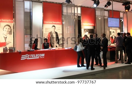 MILAN, ITALY - OCT. 19: People visit Telecom technologies stand during SMAU, international fair of business intelligence and information technology October 19, 2011 in Milan, Italy.