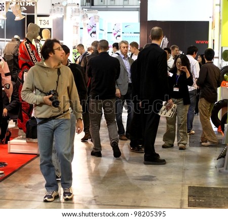 MILAN, ITALY - NOV. 11: People visit motorcycle exhibition area at EICMA, 67th International Motorcycle Exhibition November 11, 2009 in Milan, Italy.